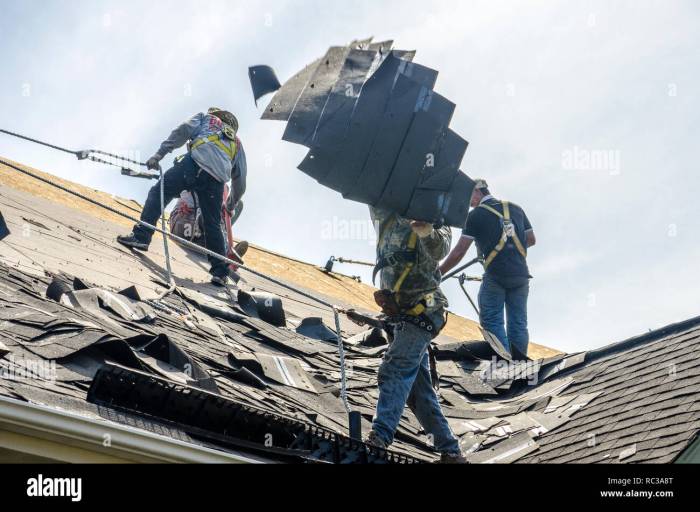 Roofing Contractors Replacing Damaged Roofs After a Hail Storm Stock ...