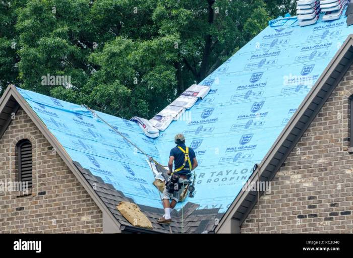 Roofing Contractors Replacing Damaged Roofs After a Hail Storm Stock ...