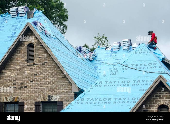 Roofing Contractors Replacing Damaged Roofs After a Hail Storm Stock ...